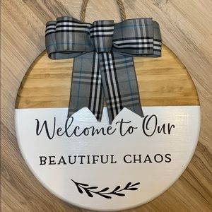 Welcome to our beautiful chaos door sign.